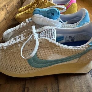 Nike Beige Mesh Sneakers with Light Blue Swoosh